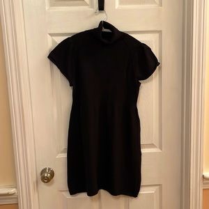 Black Calvin Klein short sleeved short sweater dress. Size M